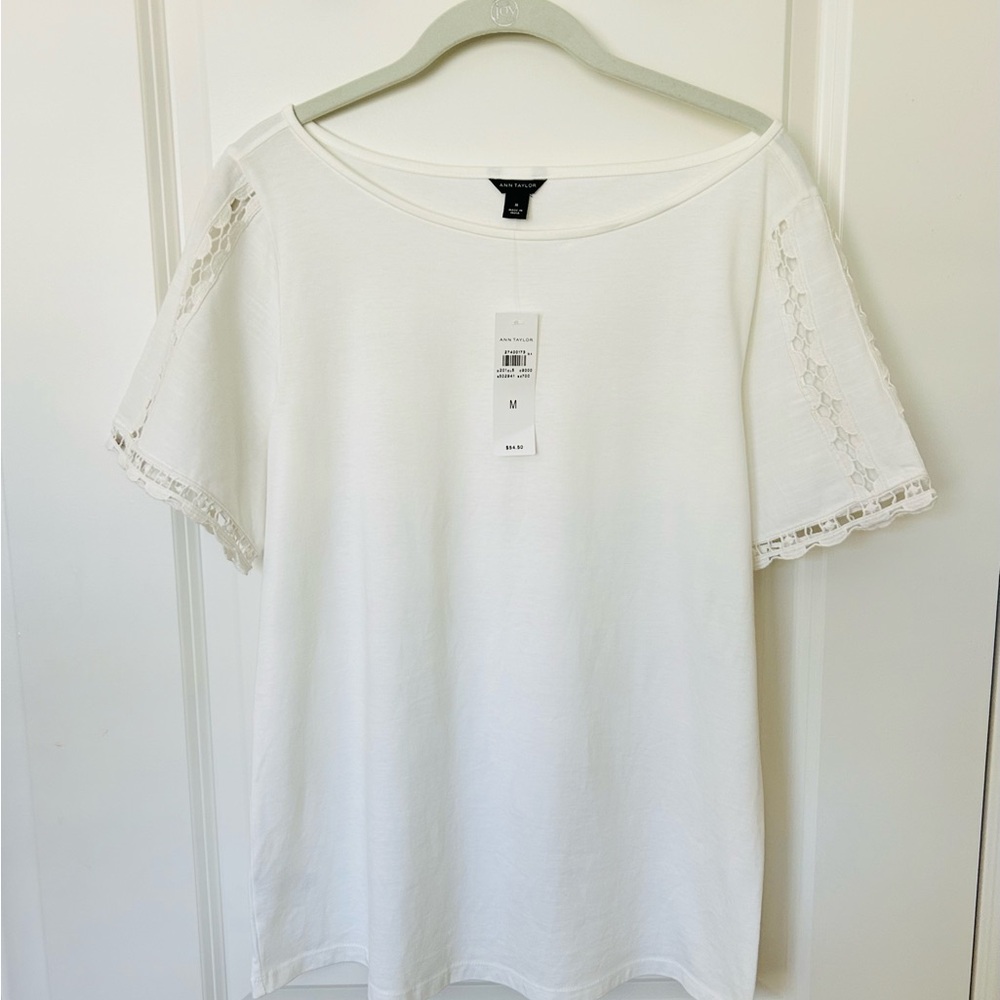 NWT Ann Taylor white top with lace detail on sleeves. Size medium.